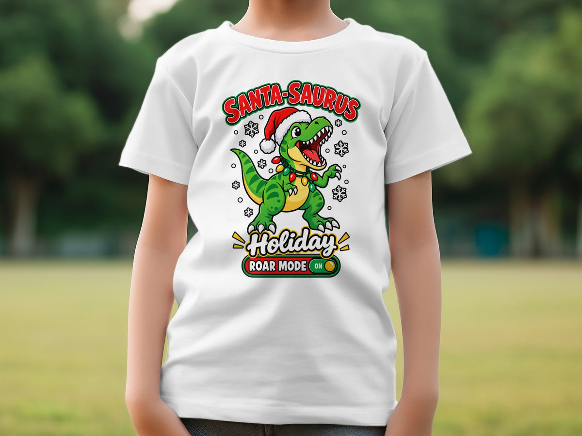 White t-shirt with cartoon dinosaur wearing Santa hat, "Santa-Saurus Holiday Roar Mode ON".