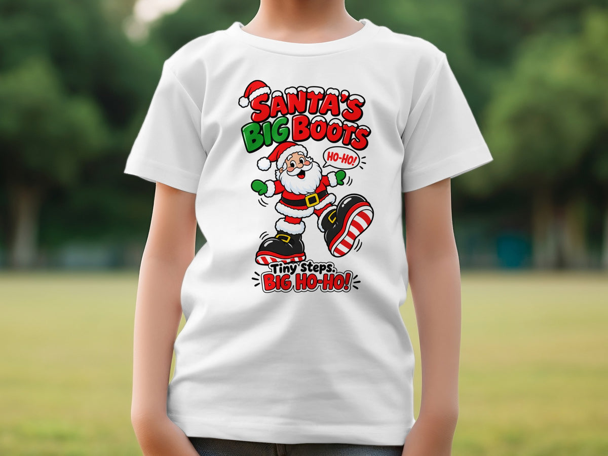 Santa Claus graphic on a white t-shirt with text "Santa's Big Boots" and "Tiny Steps. Big Ho-Ho!".