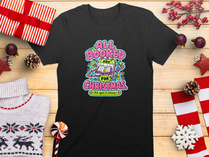 Black t-shirt with text "All Booked for Christmas. (Ask again in January.)".