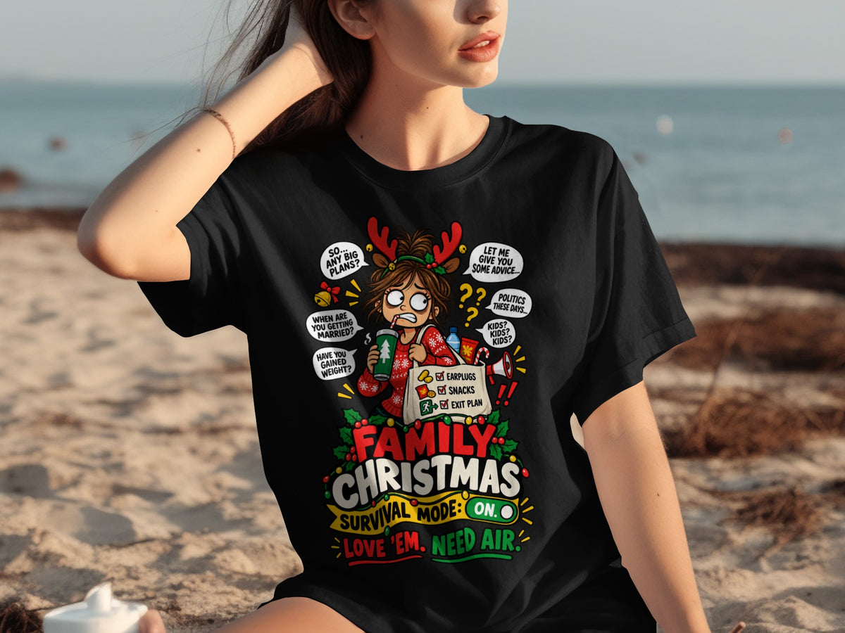 Black t-shirt with "Family Christmas Survival Mode: On. Love 'em. Need Air." graphic.