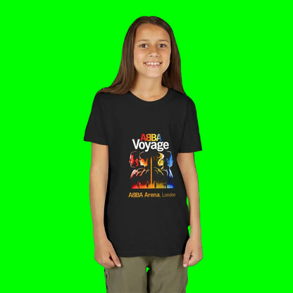 Person wearing a black t-shirt with ABBA design on a green background
