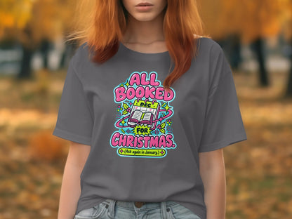 Gray t-shirt with "ALL BOOKED FOR CHRISTMAS (Ask again in January)" graphic.
