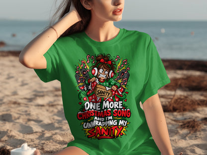 Green t-shirt with graphic "One More Christmas Song And I'm Unwrapping My Sanity".