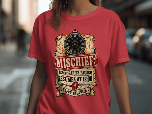 Red t-shirt with "Mischief: Temporarily Paused Resumes At 12:00 Happy Halloween" graphic.