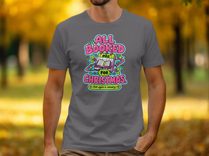 Grey t-shirt with "All Booked for Christmas (Ask again in January)" graphic.
