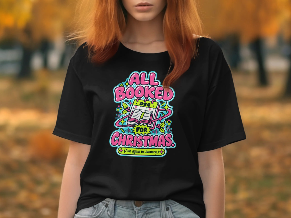 Black t-shirt with "All Booked For Christmas" text and calendar graphic.