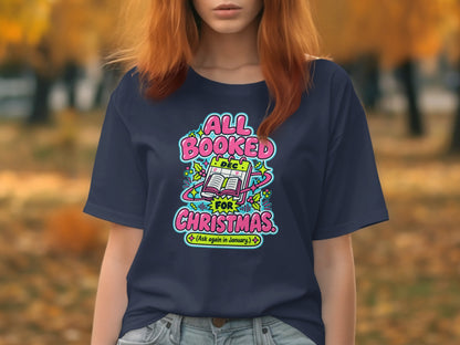 Navy t-shirt with "All Booked For Christmas" and a calendar graphic.