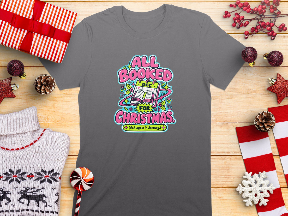 Gray t-shirt with "All Booked for Christmas (Ask again in January)" graphic.
