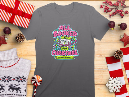 Gray t-shirt with "All Booked for Christmas (Ask again in January)" graphic.
