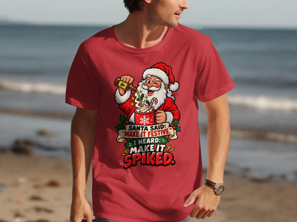Santa pouring liquor into a festive mug with text "Make It Spiked".