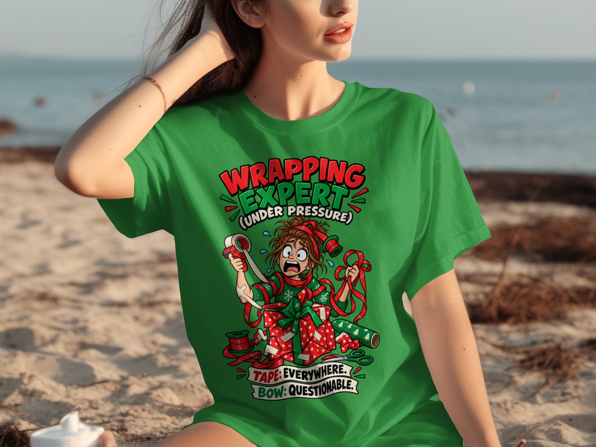 Green t-shirt with "Wrapping Expert (Under Pressure)" design featuring a chaotic gift wrapper.
