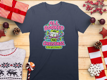 Dark grey t-shirt with "All Booked For Christmas (Ask again in January)" text design.