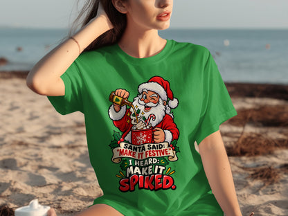 Santa pouring a drink into a mug with text "MAKE IT SPIKED."