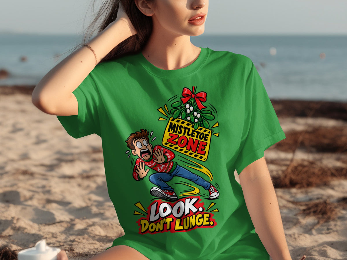 Green t-shirt with cartoon of man running from mistletoe, "Mistletoe Zone," and "Look. Don't Lunge."