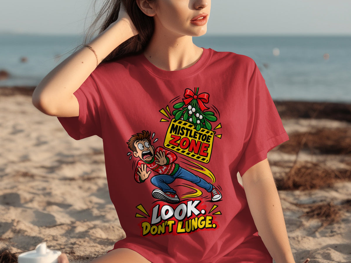 Red t-shirt graphic: man in festive sweater dodges mistletoe zone, text reads "Look. Don't Lunge."