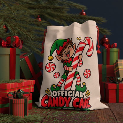 Elf holding candy cane with "Official Candy Cane" text on a Santa sack.