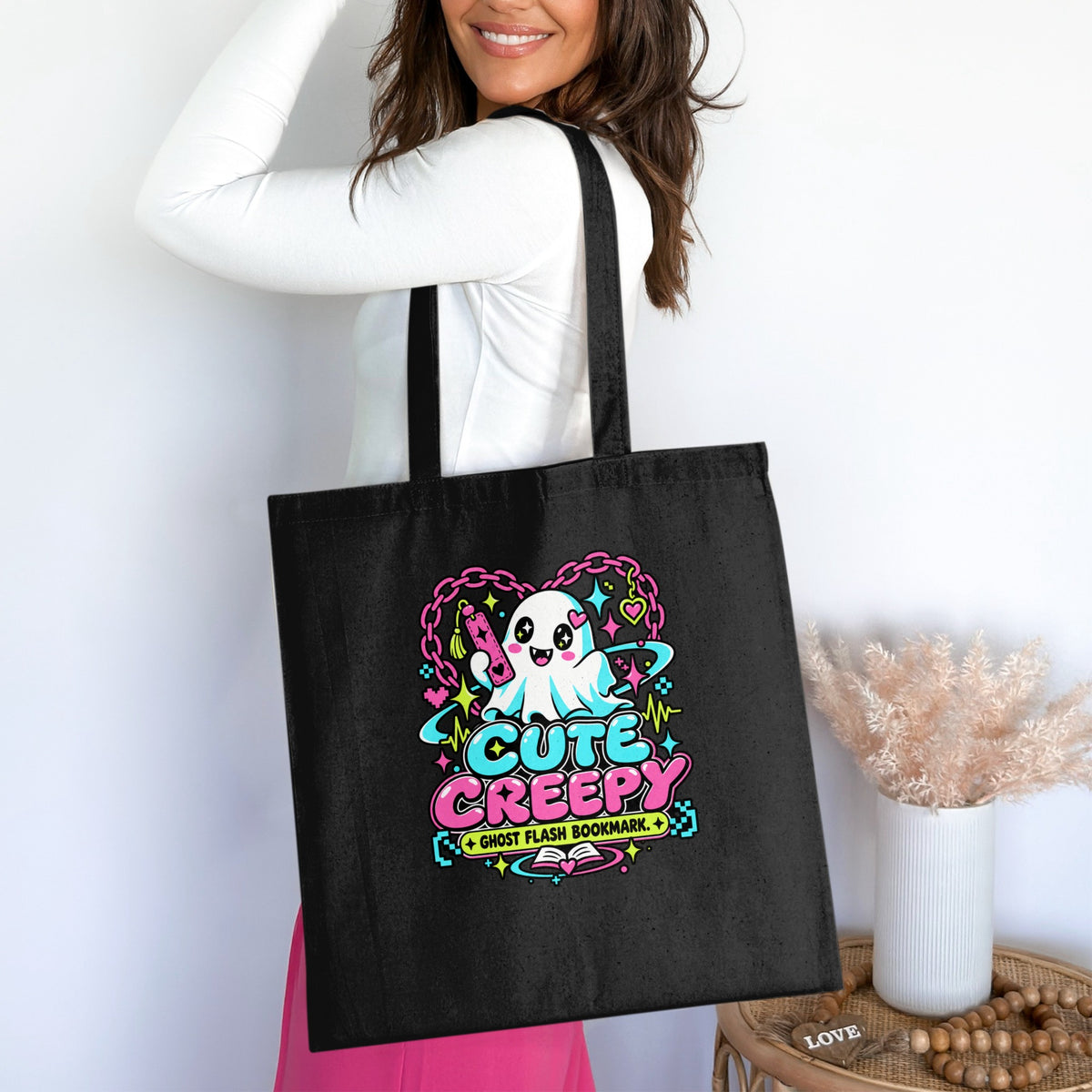 Black tote bag featuring a cartoon ghost with the text "Cute Creepy Ghost Flash Bookmark".