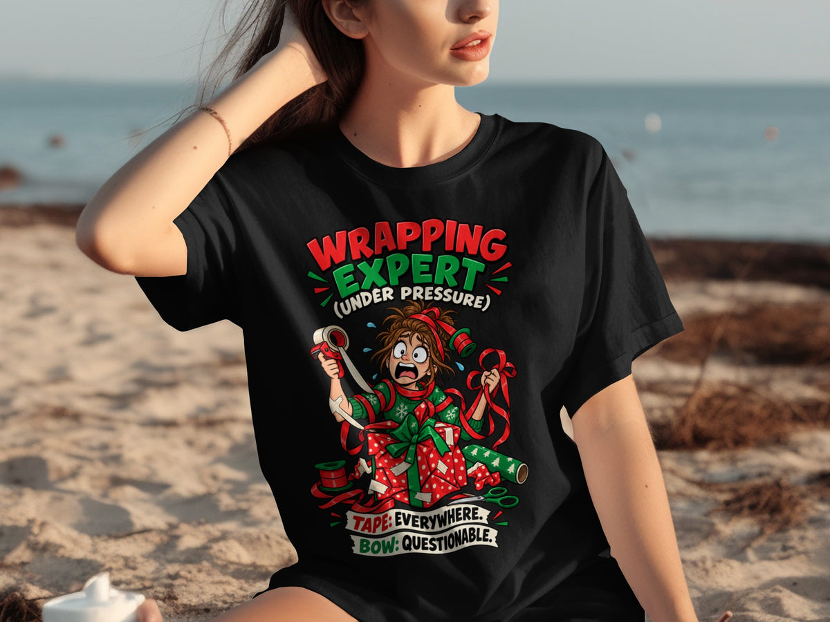 Black t-shirt with "Wrapping Expert (Under Pressure)" graphic and cartoon character.