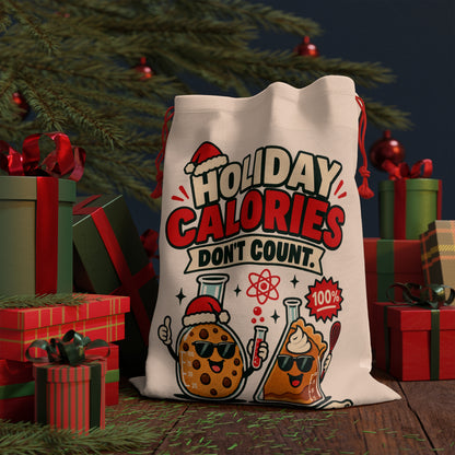 Cream drawstring bag with "Holiday Calories Don't Count" and cartoon cookie and pie.